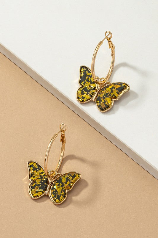 Acetate butterfly dangling on a hoop earrings